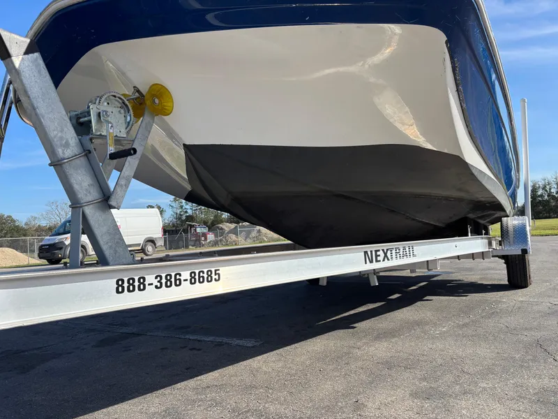 Slide: The Image of 2021 Hurricane SS 201 boat on trailer, parked outdoors. - 13