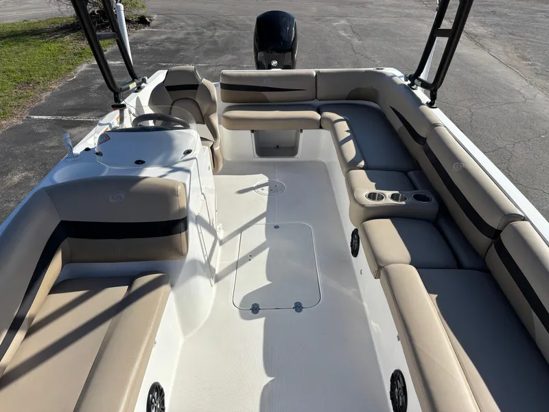 Slide: The Image of 2021 Hurricane SS 201 boat interior with beige seating and cup holders. - 17
