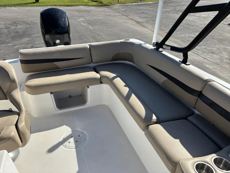 Slide: The Image of 2021 Hurricane SS 201 boat interior with beige seating and cup holders. - 18