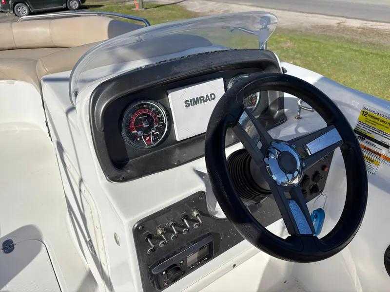 Slide: The Image of Dashboard of 2021 Hurricane SS 201 boat with steering wheel and controls. - 23