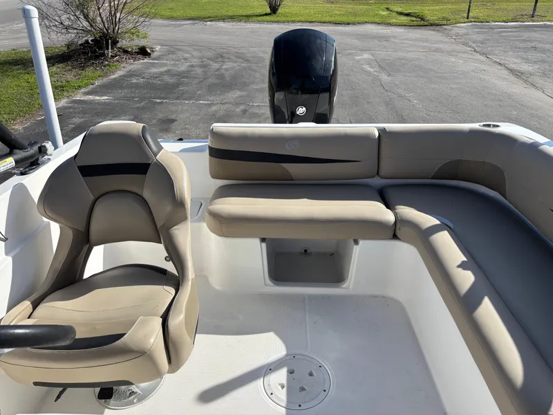 Slide: The Image of 2021 Hurricane SS 201 boat interior with beige seating and steering chair. - 25