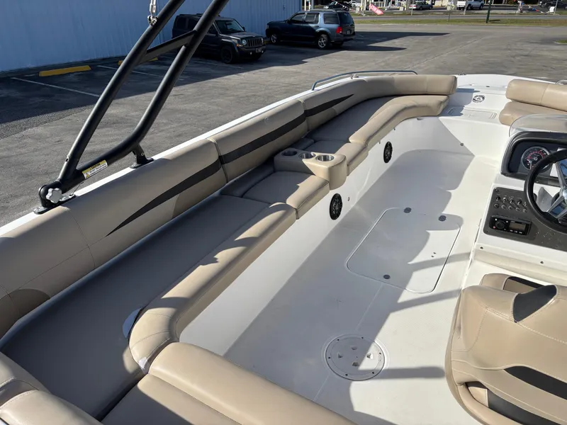 Slide: The Image of 2021 Hurricane SS 201 boat interior with beige seating and steering console. - 27