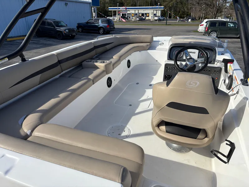 Slide: The Image of 2021 Hurricane SS 201 boat interior with beige seating and steering console. - 28