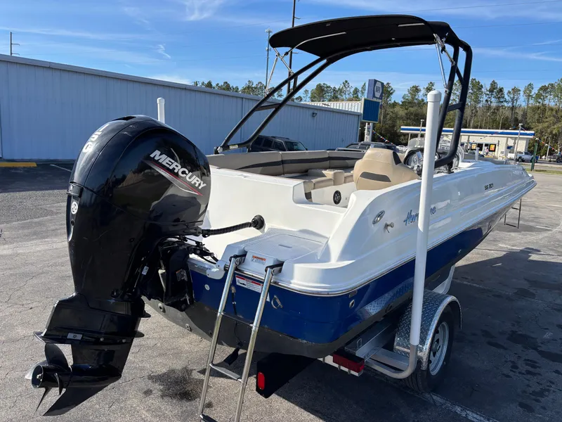 Slide: The Image of 2021 Hurricane SS 201 boat with Mercury outboard motor on trailer. - 29