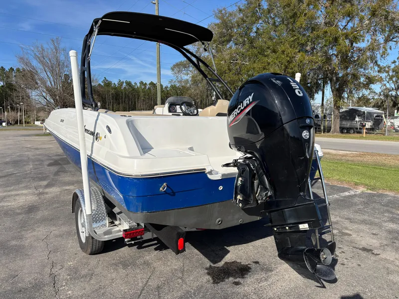 Slide: The Image of 2021 Hurricane SS 201 boat with Mercury outboard motor on a trailer. - 31
