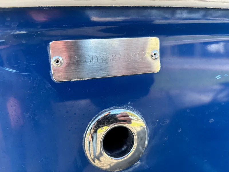 Slide: The Image of 2021 Hurricane SS 201 boat with identification plate on blue hull. - 32