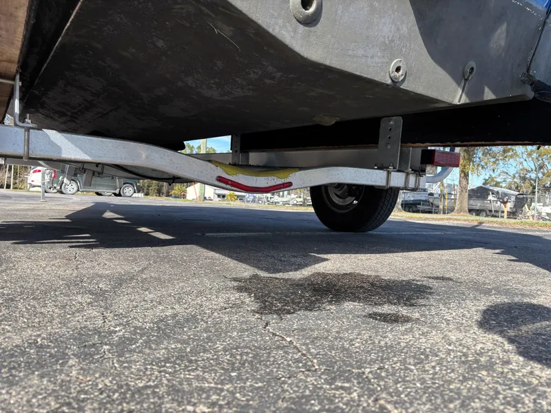Slide: The Image of Underneath view of a 2021 Hurricane SS 201 boat on a trailer in a parking lot. - 34