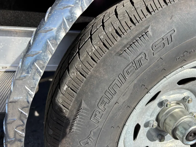 Slide: The Image of Close-up of a Rainier ST tire on a 2021 Hurricane SS 201 trailer. - 36