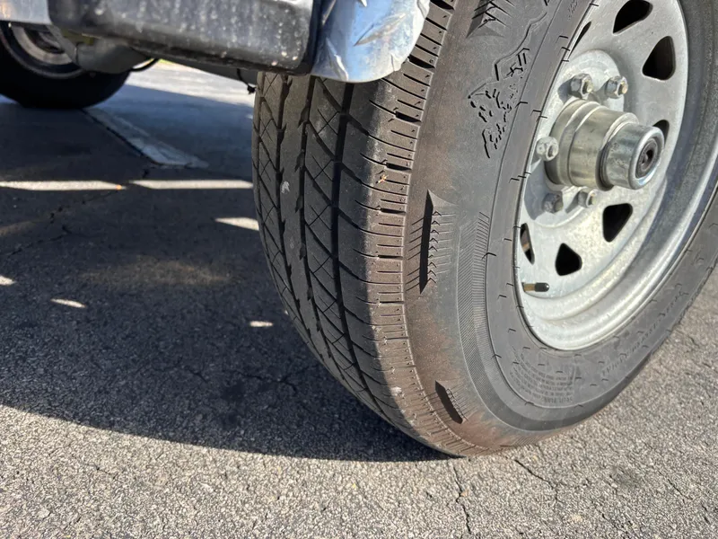 Slide: The Image of Close-up of a worn tire on a 2021 Hurricane SS 201 vehicle. - 37