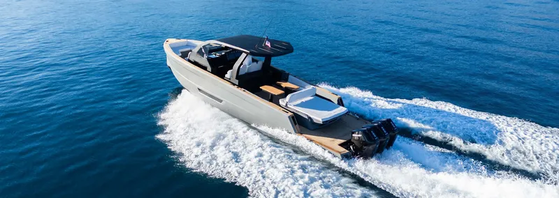 Slide: The Image of 2025 Maxim Yachts MAX44R cruising on open water, showcasing sleek design and powerful performance. - 1