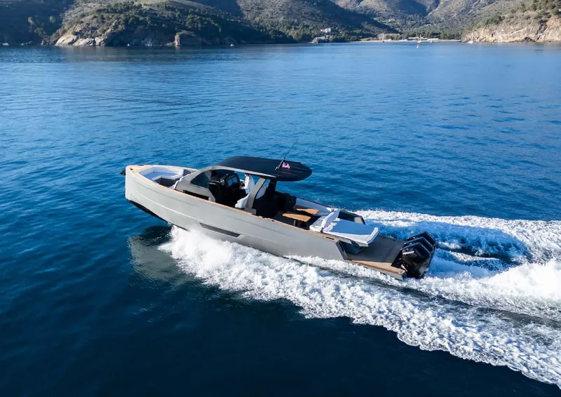 Slide: The Image of 2025 Maxim Yachts MAX44R cruising on serene blue waters, showcasing sleek design and performance. - 10