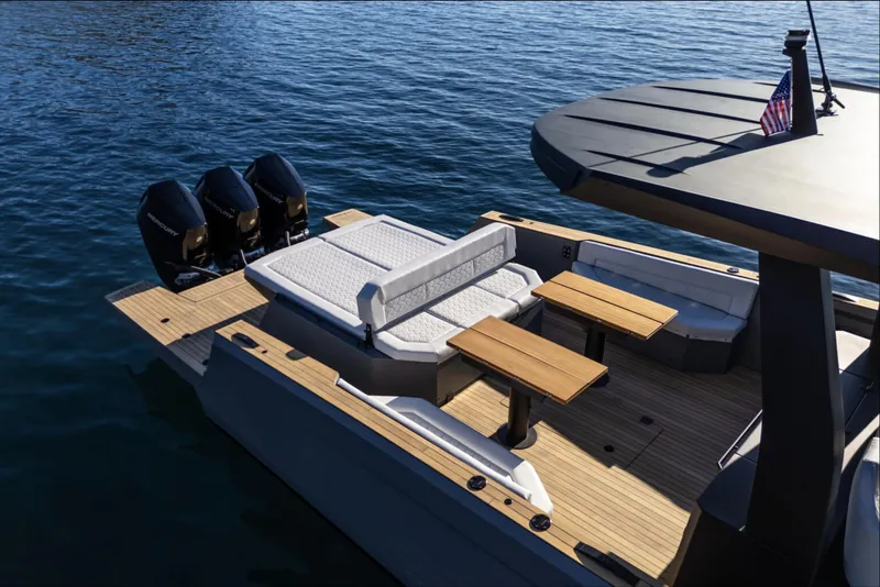Slide: The Image of 2025 Maxim Yachts MAX44R luxury boat with spacious deck and triple engines on water. - 11