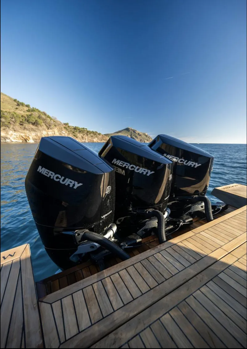 Slide: The Image of 2025 Maxim Yachts MAX44R with triple Mercury outboard engines on a wooden dock. - 15
