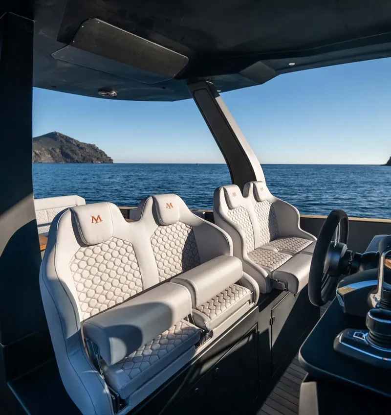 Slide: The Image of Luxury interior of 2025 Maxim Yachts MAX44R, featuring elegant seating and ocean view. - 19
