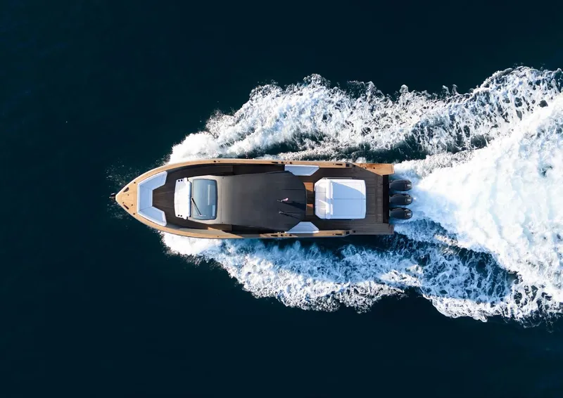 Slide: The Image of Aerial view of 2025 Maxim Yachts MAX44R cruising on open water. - 2