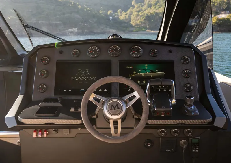 Slide: The Image of Cockpit of 2025 Maxim Yachts MAX44R, featuring advanced navigation and control systems. - 21