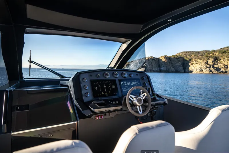 Slide: The Image of Interior view of 2025 Maxim Yachts MAX44R cockpit with scenic ocean backdrop. - 22