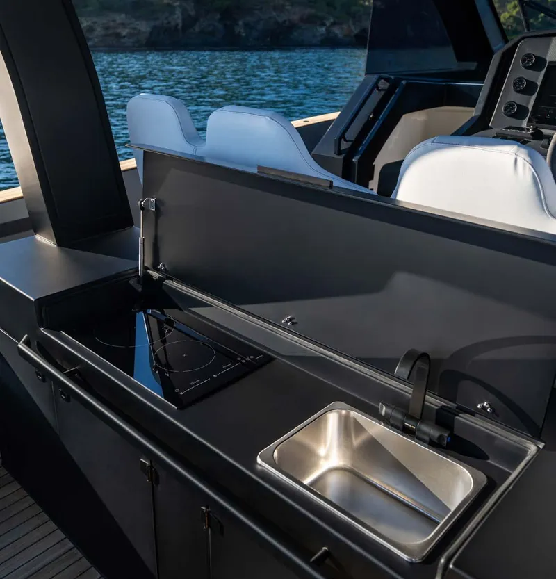 Slide: The Image of Modern kitchen area on 2025 Maxim Yachts MAX44R, featuring sleek design and stainless steel sink. - 23