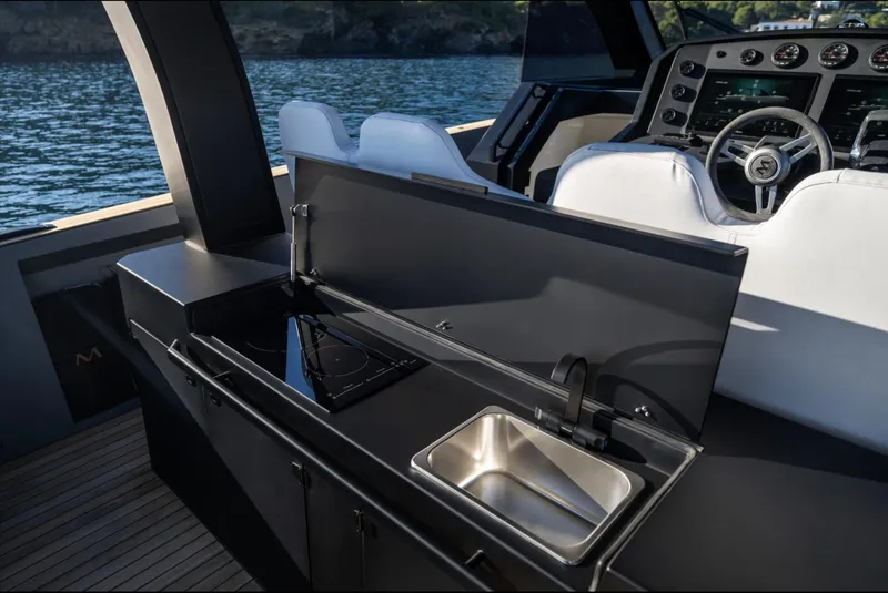 Slide: The Image of Luxury yacht kitchen and helm, Maxim Yachts MAX44R 2025, sleek design, modern amenities. - 24