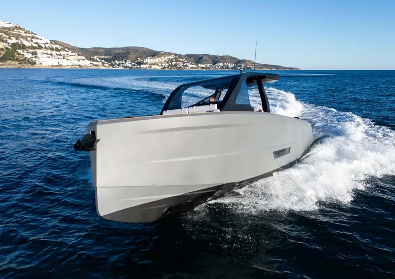 Slide: The Image of 2025 Maxim Yachts MAX44R cruising on open water, showcasing sleek design and modern features. - 3