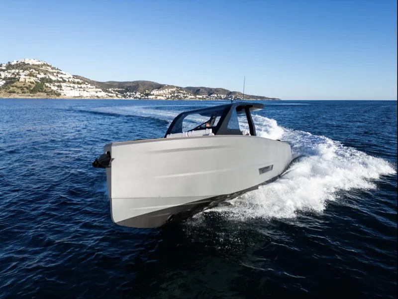 Slide: The Image of 2025 Maxim Yachts MAX44R cruising on open water, coastal landscape in background. - 4