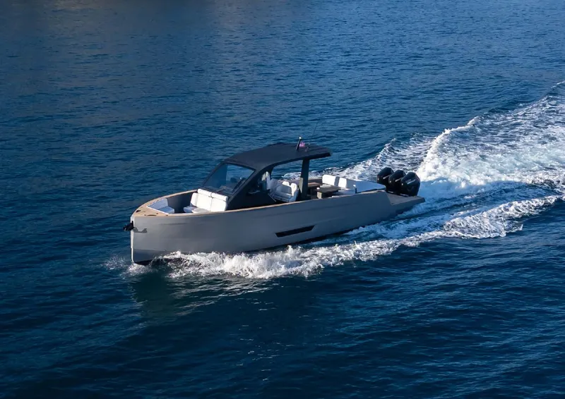 Slide: The Image of 2025 Maxim Yachts MAX44R cruising on open water, showcasing sleek design and powerful engines. - 8