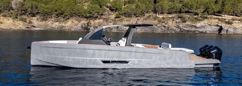 Slide: The Image of 2025 Maxim Yachts MAX44R luxury boat on serene water, surrounded by lush greenery. - 9