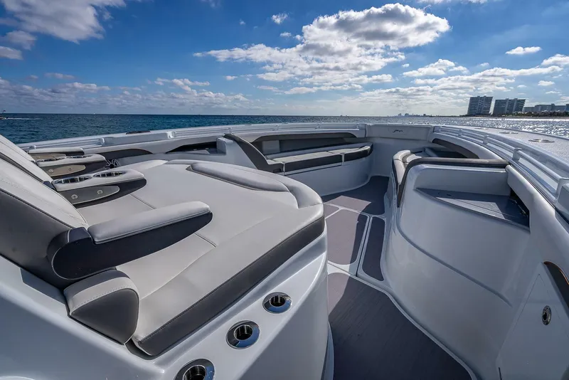 Slide: The Image of 2024 Yellowfin 54 Offshore boat interior with luxurious seating and ocean view. - 26