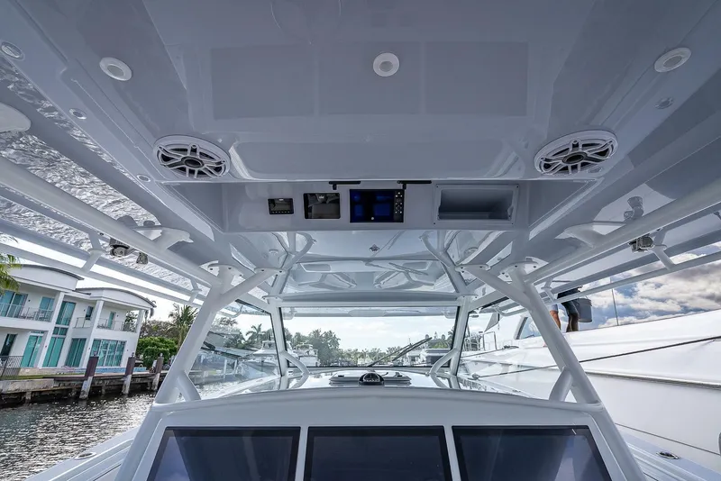 Slide: The Image of 2024 Yellowfin 54 Offshore boat interior with advanced navigation system and sleek design. - 30