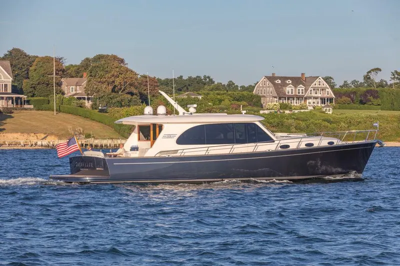 Slide: The Image of Eastbay EB60 yacht cruising on a scenic waterway, 2026 model. - 10