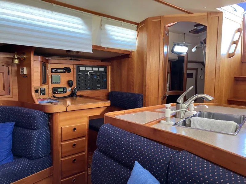 Slide: The Image of Interior of 1997 Sabre 402 yacht with wood finish and modern amenities. - 10