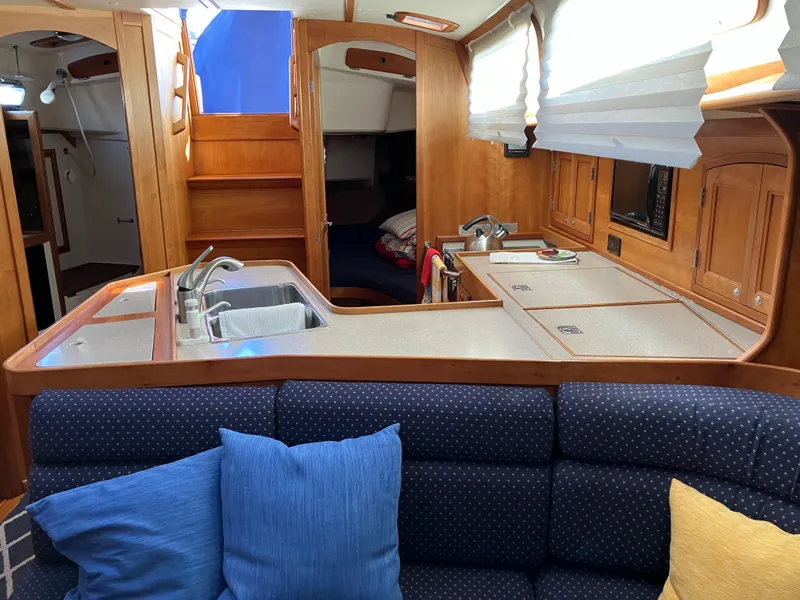 Slide: The Image of Interior of 1997 Sabre 402 yacht with kitchen and seating area. - 19