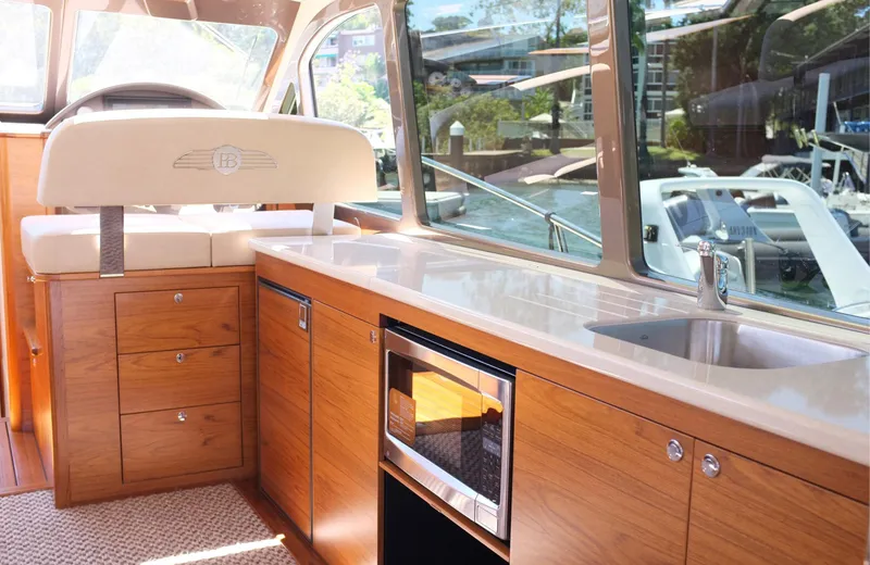 Slide: The Image of Luxurious interior of 2026 Palm Beach Motor Yachts PB45 with sleek wood cabinetry. - 18