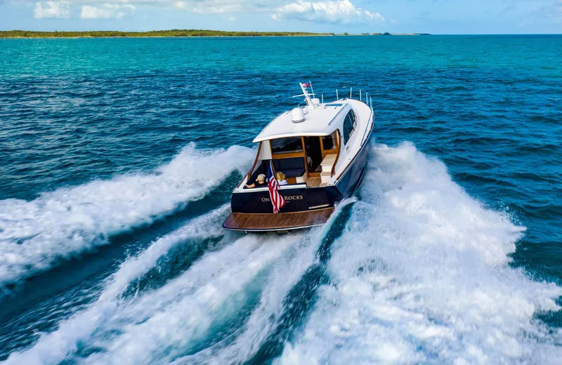 Slide: The Image of 2026 Palm Beach Motor Yachts PB45 cruising on open blue ocean waters. - 4