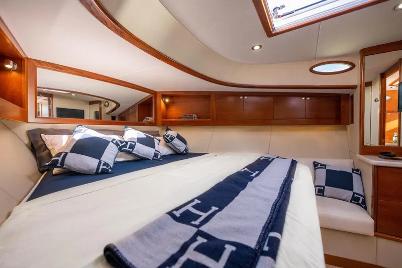 Slide: The Image of Luxurious cabin interior of 2026 Palm Beach Motor Yachts PB45 with elegant bedding. - 11