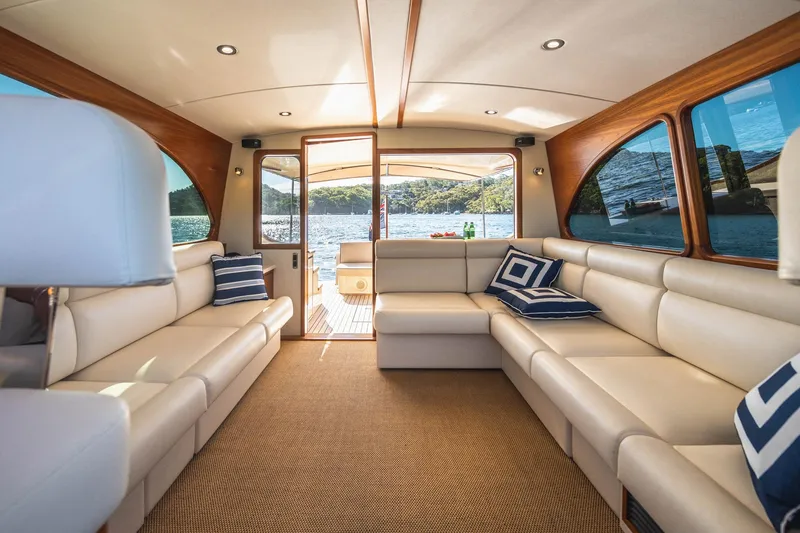 Slide: The Image of Luxurious interior of 2026 Palm Beach Motor Yachts PB45 with elegant seating and scenic water view. - 19