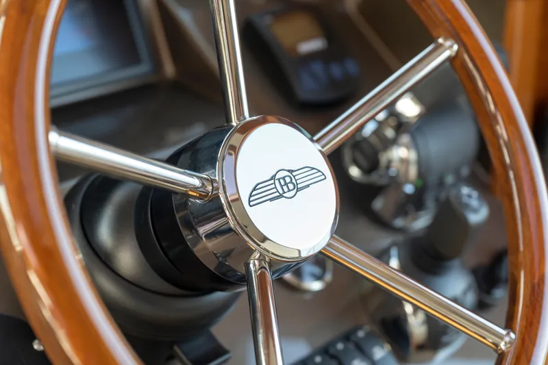 Slide: The Image of Steering wheel of 2026 Palm Beach Motor Yachts PB45, showcasing luxury design details. - 20