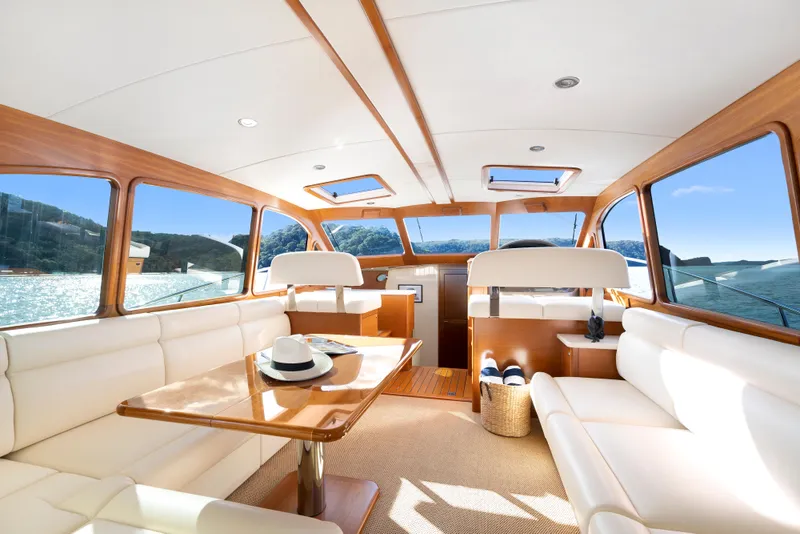 Slide: The Image of Luxurious interior of 2026 Palm Beach Motor Yachts PB45 with elegant seating and panoramic windows. - 7