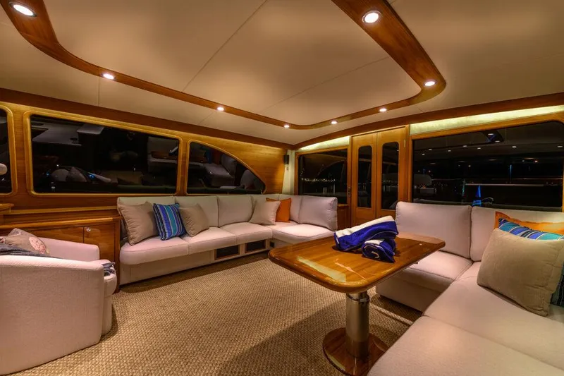 Slide: The Image of Luxurious interior of 2026 Palm Beach Motor Yachts PB50 with elegant seating and ambient lighting. - 16