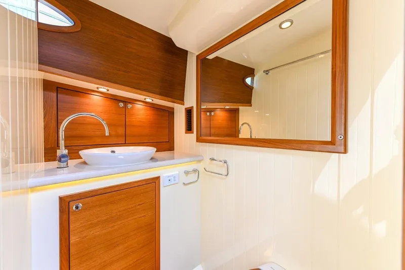 Slide: The Image of Luxurious bathroom interior of 2026 Palm Beach Motor Yachts PB50, featuring elegant wood finishes. - 17