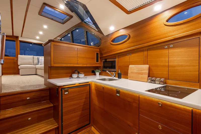 Slide: The Image of Luxurious 2026 Palm Beach Motor Yachts PB50 interior with elegant wood finish and modern amenities. - 23
