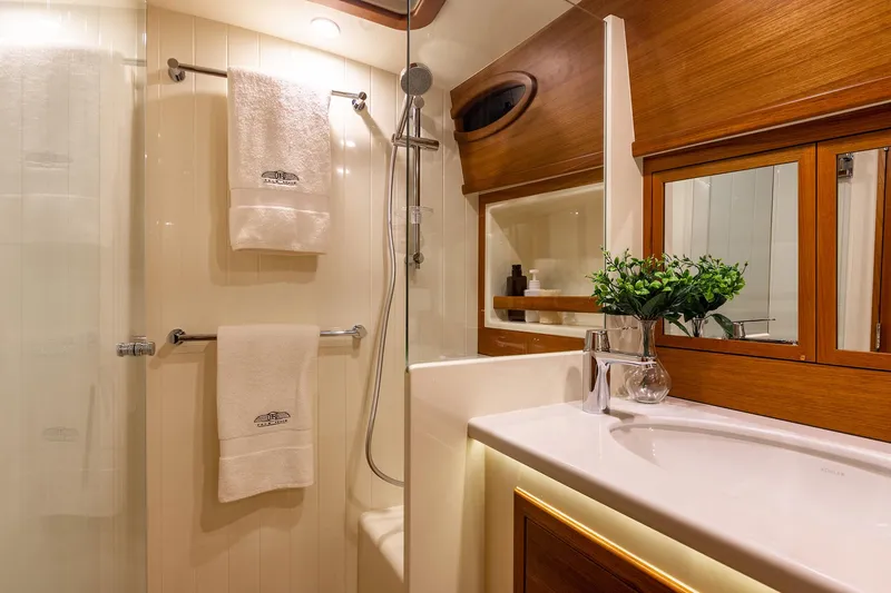 Slide: The Image of Luxurious bathroom in 2026 Palm Beach Motor Yachts PB50, featuring elegant wood accents and modern fixtures. - 25