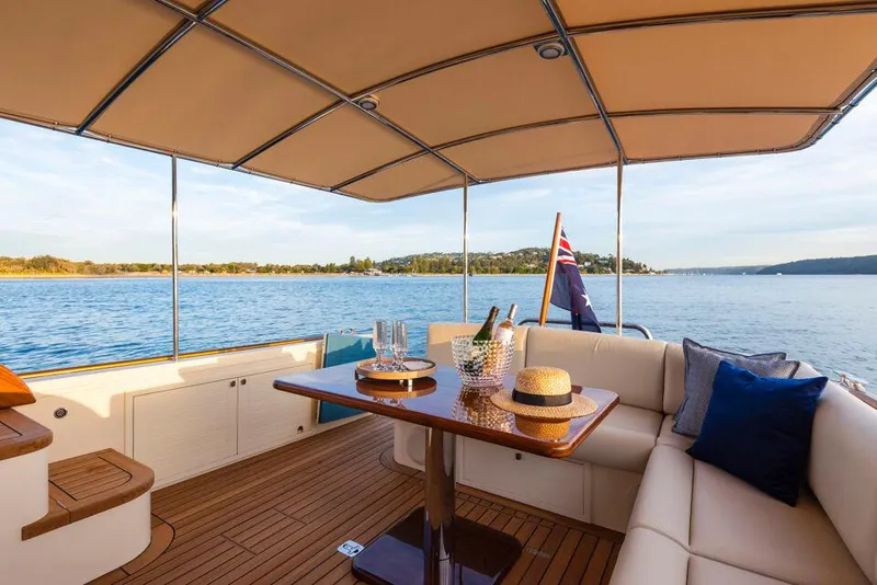 Slide: The Image of Luxurious 2026 Palm Beach Motor Yachts PB50 interior with elegant seating and scenic water view. - 6