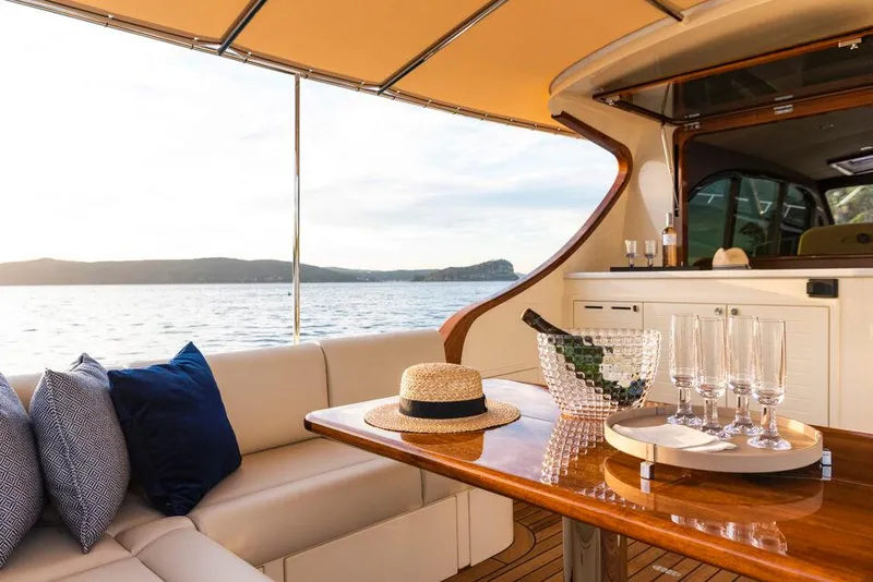 Slide: The Image of Luxurious 2026 Palm Beach Motor Yachts PB50 interior with elegant seating and scenic ocean view. - 12