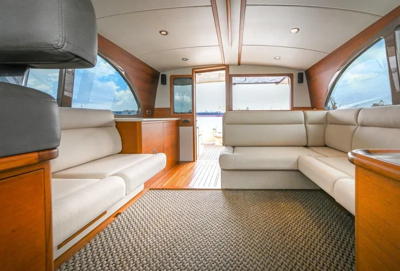 Slide: The Image of Luxurious interior of 2026 Palm Beach Motor Yachts PB50 with elegant seating and wood accents. - 13