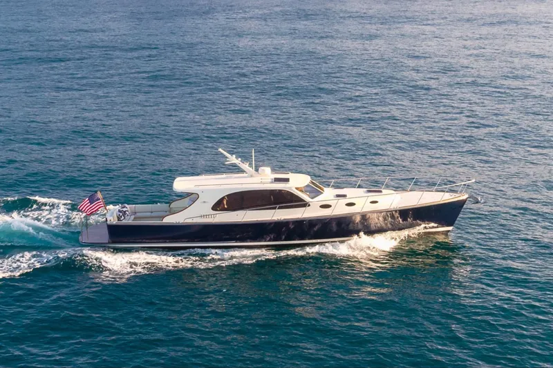 Slide: The Image of 2026 Palm Beach Motor Yachts PB50 cruising on open water. - 1
