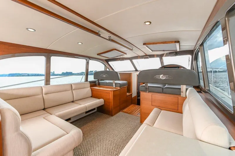 Slide: The Image of Luxurious interior of 2026 Palm Beach Motor Yachts PB50 with elegant seating and panoramic windows. - 14