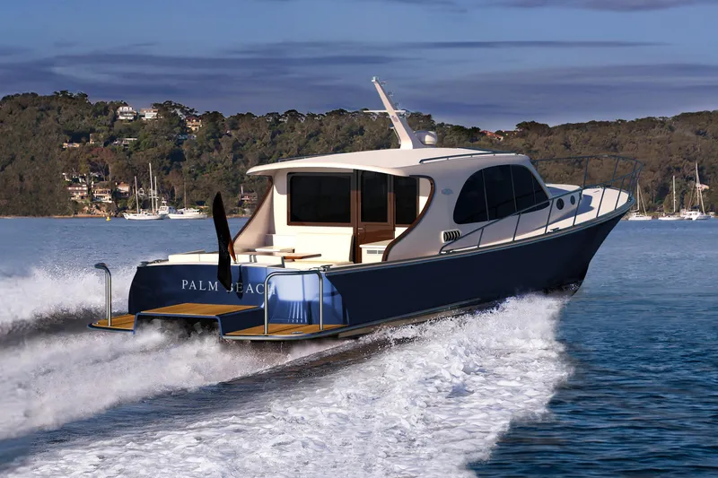 Slide: The Image of 2026 Palm Beach Motor Yachts PB50 cruising on serene waters near a wooded shoreline. - 3