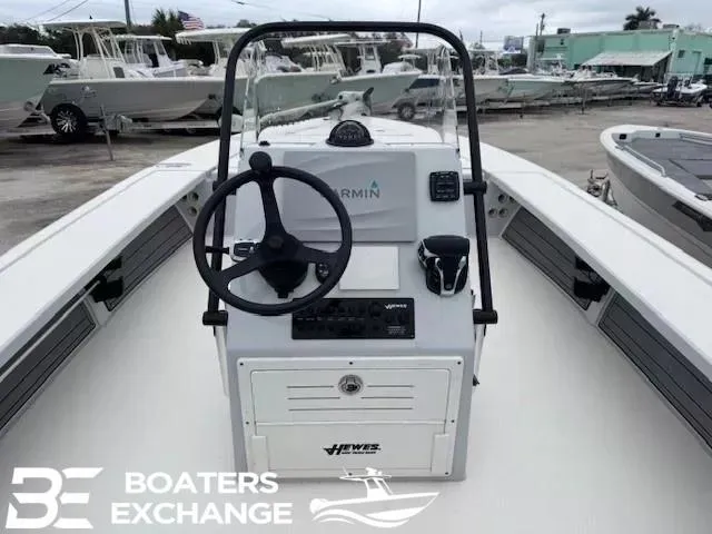 Slide: The Image of 2021 Hewes 21 REDFISHER boat console with steering wheel and Garmin system at Boaters Exchange. - 4