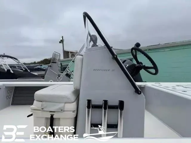 Slide: The Image of 2021 Hewes 21 REDFISHER boat console with steering wheel and seating at Boaters Exchange. - 6